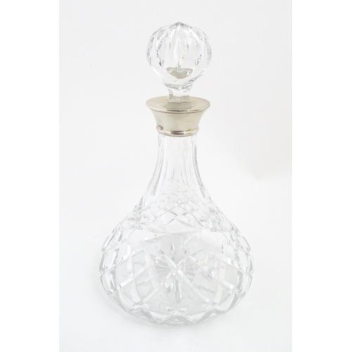 316 - A lead crystal decanter with silver mount hallmarked Birmingham 1978, maker Mappin & Webb. Approx. 1... 