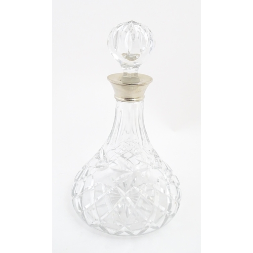 316 - A lead crystal decanter with silver mount hallmarked Birmingham 1978, maker Mappin & Webb. Approx. 1... 