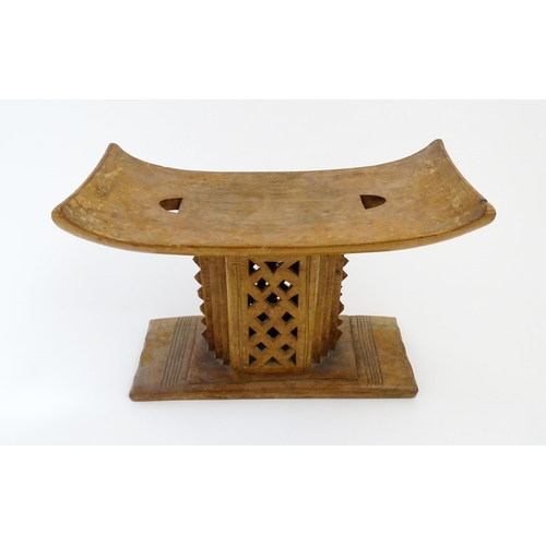 1195 - Ethnographic / Native / Tribal: An African carved wooden Ashanti / Asante stool with pierced and ban... 