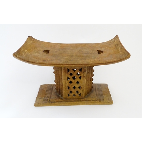 1195 - Ethnographic / Native / Tribal: An African carved wooden Ashanti / Asante stool with pierced and ban... 