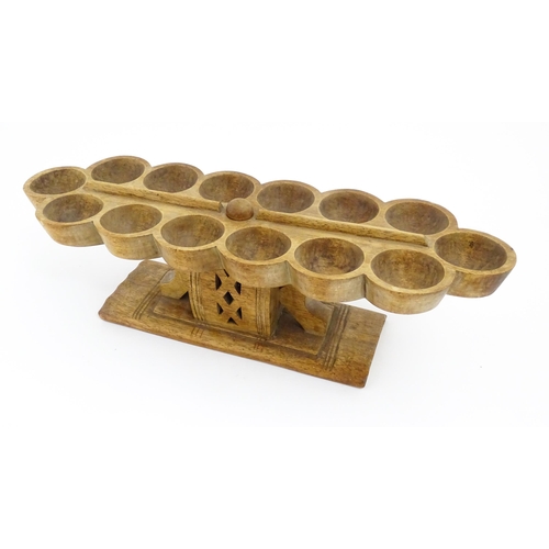 1197 - Ethnographic / Native / Tribal: An African Ashanti / Asante mancala games board raised on a carved a... 