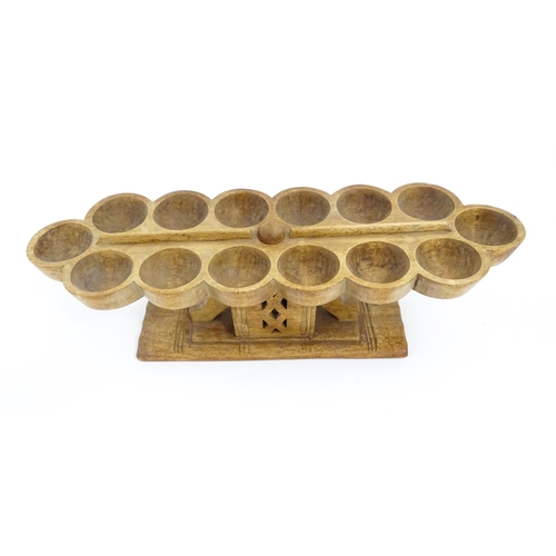 1197 - Ethnographic / Native / Tribal: An African Ashanti / Asante mancala games board raised on a carved a... 