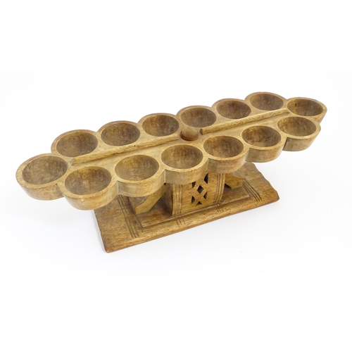 1197 - Ethnographic / Native / Tribal: An African Ashanti / Asante mancala games board raised on a carved a... 