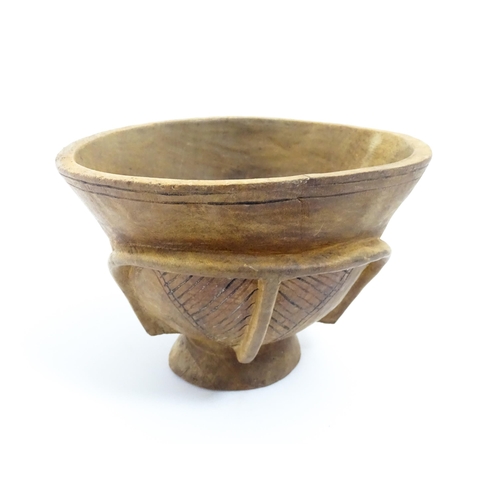 1199 - Ethnographic / Native / Tribal: A carved wooden footed bowl with incised decoration. Approx. 4 1/2