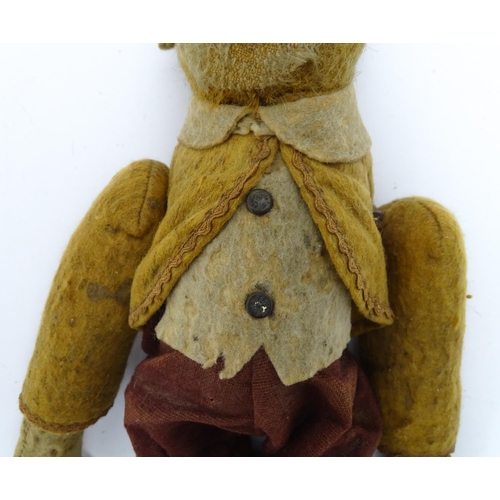 1432 - Toy: An early 20thC mechanical wind up tumbling / tumbler monkey toy with felt face, ears and feet, ... 