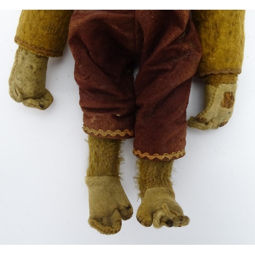 1432 - Toy: An early 20thC mechanical wind up tumbling / tumbler monkey toy with felt face, ears and feet, ... 