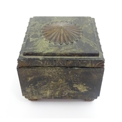 1233 - An Art Deco Ebena Bakelite box of squared form with floral motif to top. Marked under Made in Belgiu... 