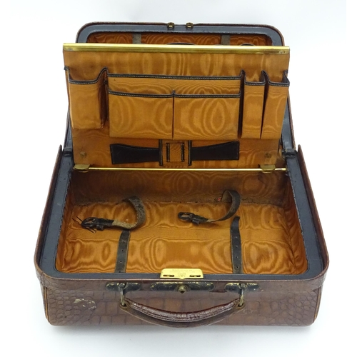 648 - A leather vanity / valise travelling case having fitted section within with various Victorian silver... 