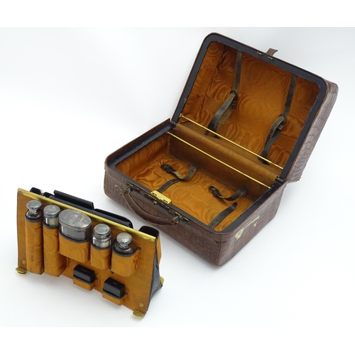 648 - A leather vanity / valise travelling case having fitted section within with various Victorian silver... 