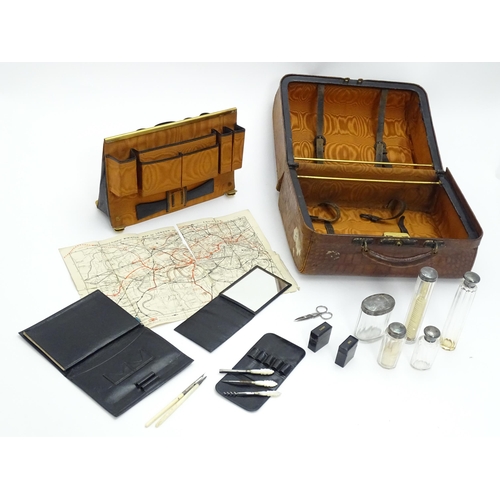 648 - A leather vanity / valise travelling case having fitted section within with various Victorian silver... 