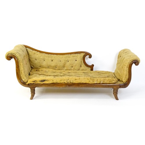 1822 - A Regency sofa frame with scrolled terminals and raised on four turned splayed feet. Deconstructed f... 