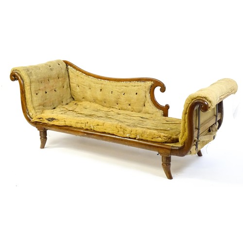 1822 - A Regency sofa frame with scrolled terminals and raised on four turned splayed feet. Deconstructed f... 