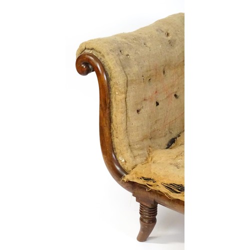 1822 - A Regency sofa frame with scrolled terminals and raised on four turned splayed feet. Deconstructed f... 