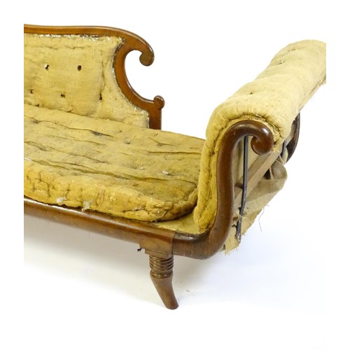 1822 - A Regency sofa frame with scrolled terminals and raised on four turned splayed feet. Deconstructed f... 