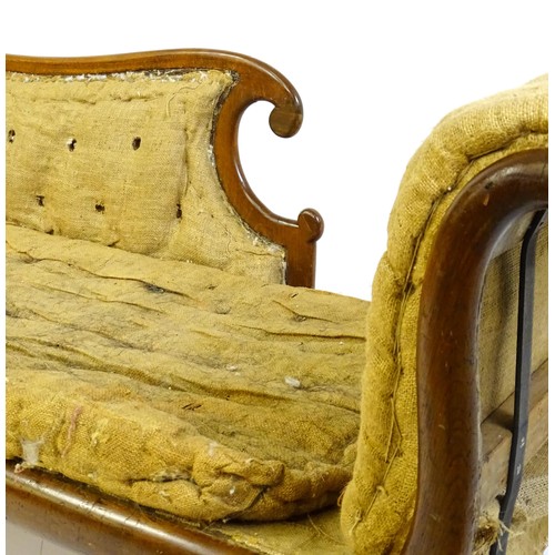 1822 - A Regency sofa frame with scrolled terminals and raised on four turned splayed feet. Deconstructed f... 