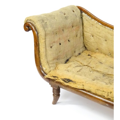 1822 - A Regency sofa frame with scrolled terminals and raised on four turned splayed feet. Deconstructed f... 