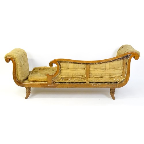 1822 - A Regency sofa frame with scrolled terminals and raised on four turned splayed feet. Deconstructed f... 