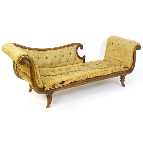 1822 - A Regency sofa frame with scrolled terminals and raised on four turned splayed feet. Deconstructed f... 