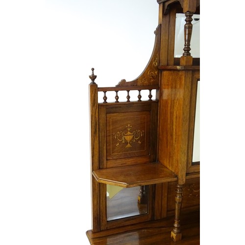 1825 - A Victorian rosewood chiffonier with a swans neck pediment above tiered shelves and mirrors, the str... 