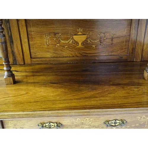 1825 - A Victorian rosewood chiffonier with a swans neck pediment above tiered shelves and mirrors, the str... 