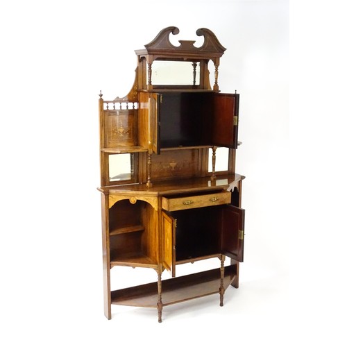 1825 - A Victorian rosewood chiffonier with a swans neck pediment above tiered shelves and mirrors, the str... 