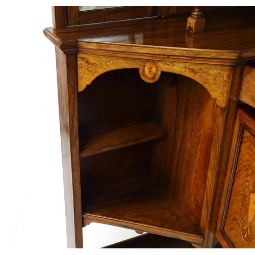 1825 - A Victorian rosewood chiffonier with a swans neck pediment above tiered shelves and mirrors, the str... 