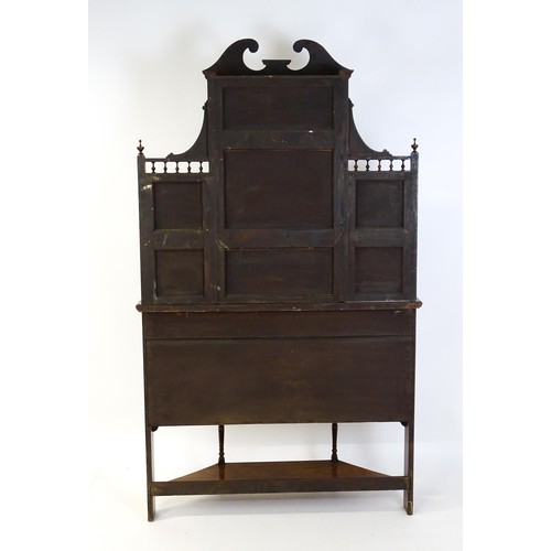 1825 - A Victorian rosewood chiffonier with a swans neck pediment above tiered shelves and mirrors, the str... 