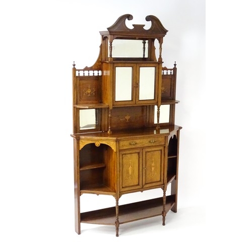 1825 - A Victorian rosewood chiffonier with a swans neck pediment above tiered shelves and mirrors, the str... 