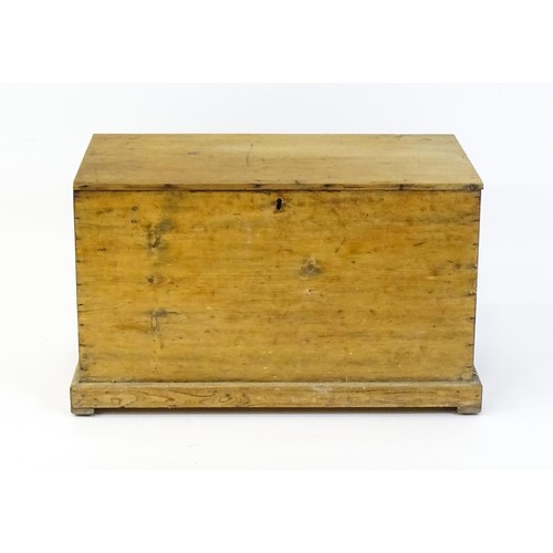 1867 - A 19thC pine blanket box with a hinged lid opening to show a candle box within. 34