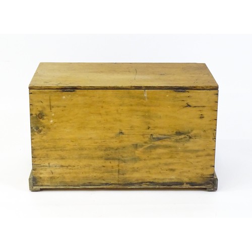 1867 - A 19thC pine blanket box with a hinged lid opening to show a candle box within. 34