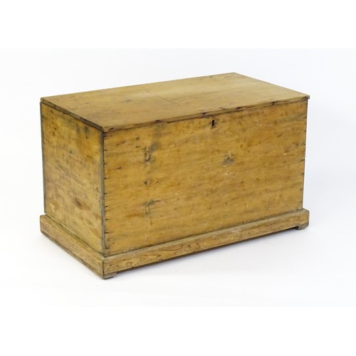 1867 - A 19thC pine blanket box with a hinged lid opening to show a candle box within. 34