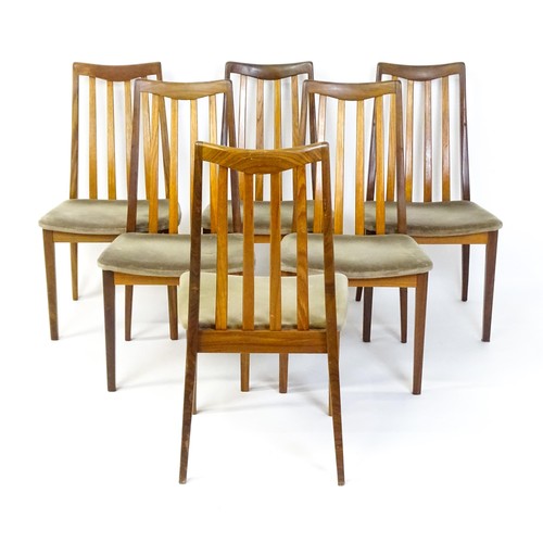 1870 - Vintage / Retro: A set of six teak G-Plan dining chairs with slatted backrests, shaped seats and rai... 