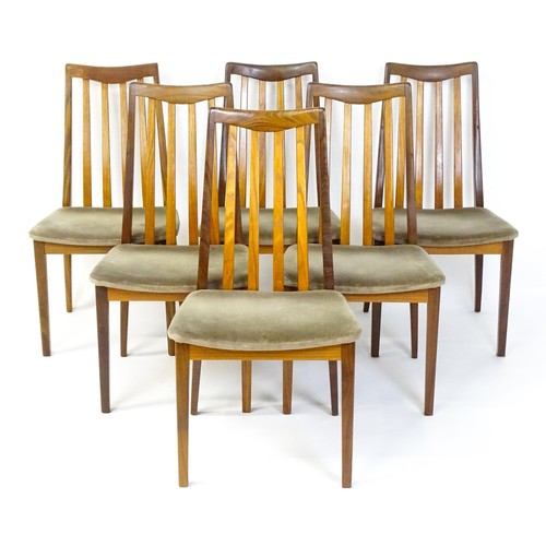 1870 - Vintage / Retro: A set of six teak G-Plan dining chairs with slatted backrests, shaped seats and rai... 