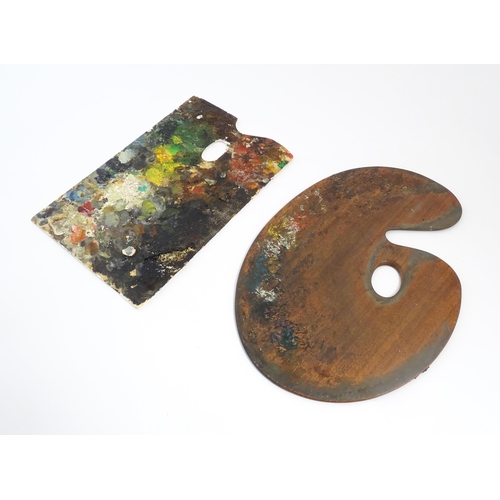 1411 - A 20thC mahogany artist's palette of shaped form. Together with another. Wooden palette approx. 15 3... 