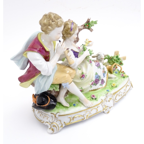 187 - A German figural group depicting shepherd and shepherdess with a lamb. Marked under. Approx. 6 3/4