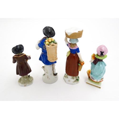 200 - Four assorted Continental figures to include examples modelled as fruit sellers, washerwomen, etc. L... 