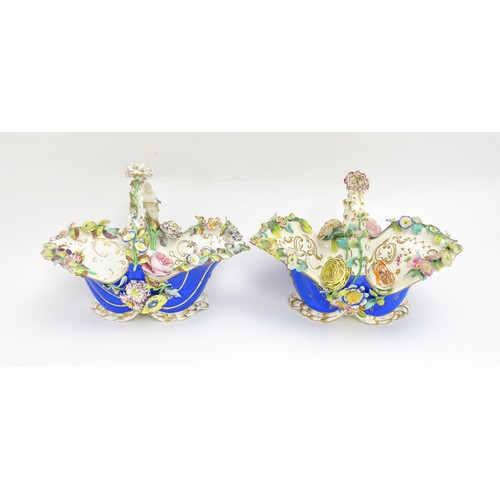 244 - Four Continental ceramic baskets with encrusted flower decoration, hand painted floral sprays and gi... 