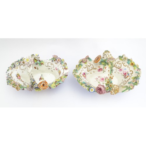 244 - Four Continental ceramic baskets with encrusted flower decoration, hand painted floral sprays and gi... 