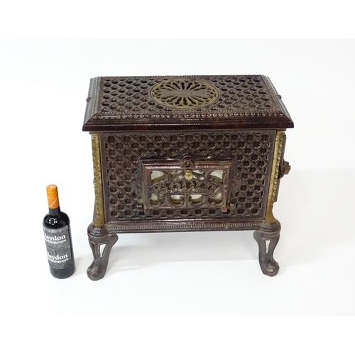 1416 - A 20thC French cast iron Godin Chauffette stove, approx 20 1/2