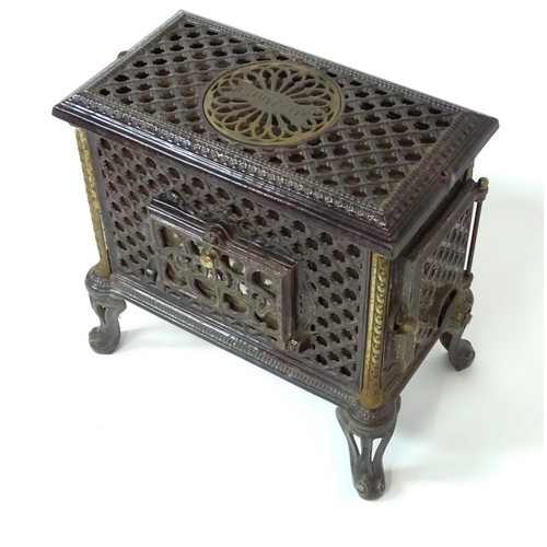 1416 - A 20thC French cast iron Godin Chauffette stove, approx 20 1/2