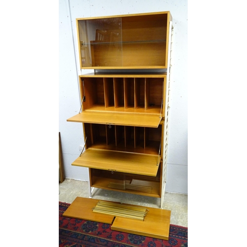 1869A - A mid 20thC Staples Ladderax teak modular shelving and storage system, consisting of two wall-mount ... 