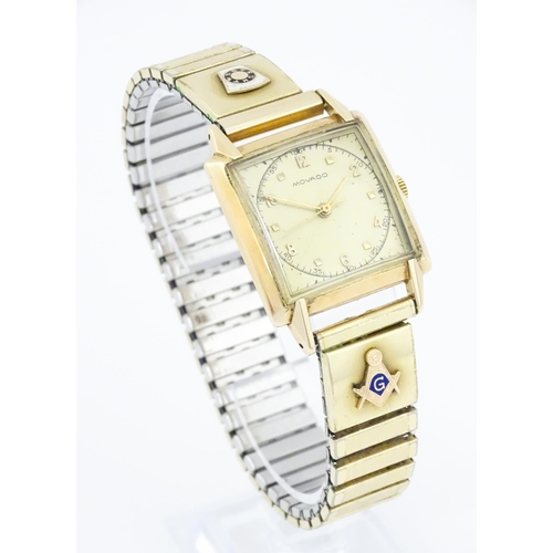 1046 - Masonic / Freemasonry Interest : A gentlemans 14ct gold cased Movado wristwatch with Arabic numerals... 