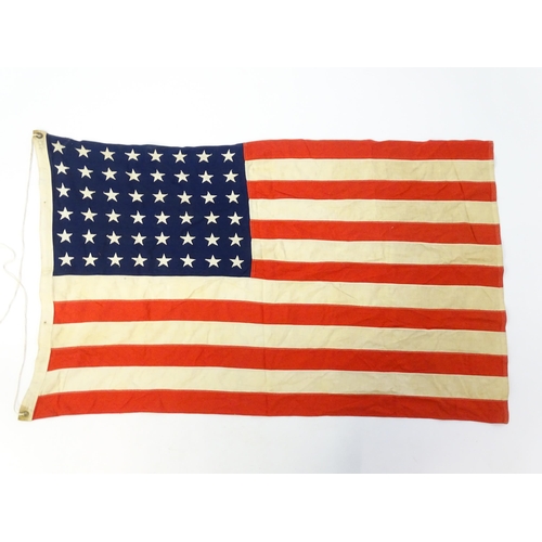 1500 - Militaria : a mid 20thC 'stars and stripes' flag of the United States of America, with 48 stars. App... 