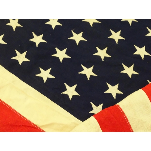 1500 - Militaria : a mid 20thC 'stars and stripes' flag of the United States of America, with 48 stars. App... 