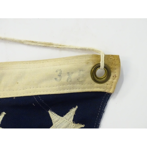 1500 - Militaria : a mid 20thC 'stars and stripes' flag of the United States of America, with 48 stars. App... 