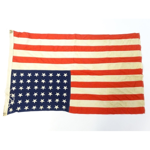 1500 - Militaria : a mid 20thC 'stars and stripes' flag of the United States of America, with 48 stars. App... 