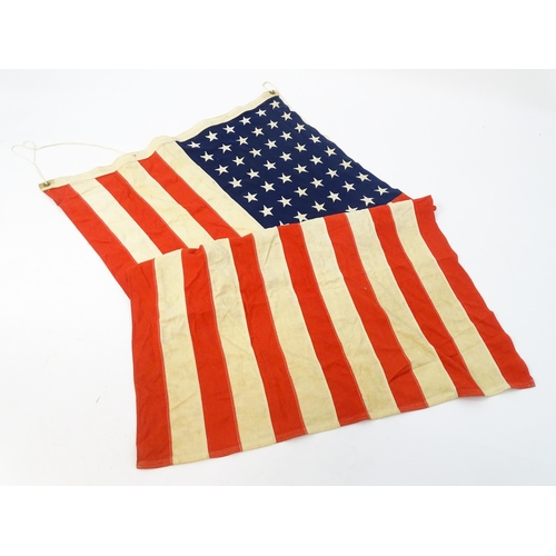 1500 - Militaria : a mid 20thC 'stars and stripes' flag of the United States of America, with 48 stars. App... 