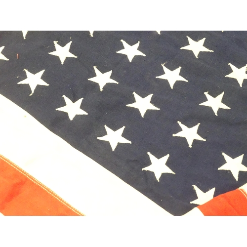 1500 - Militaria : a mid 20thC 'stars and stripes' flag of the United States of America, with 48 stars. App... 