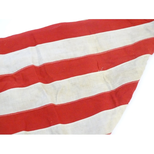 1502 - Militaria : a mid 20thC 'stars and stripes' flag of the United States of America, with 48 stars. Bea... 