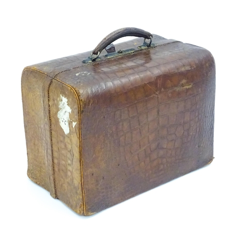 648 - A leather vanity / valise travelling case having fitted section within with various Victorian silver... 